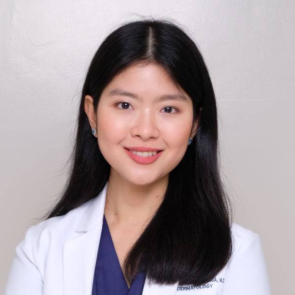 Dr. Angelie Therese T. Chua, wearing her white dermatologist’s coat